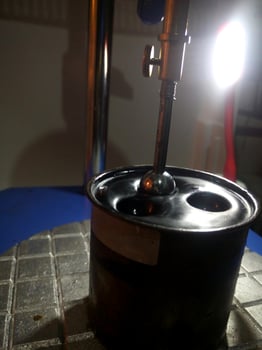 Ball penetration test on asphalt to measure the resilience of asphalt mixtures with additives. photo