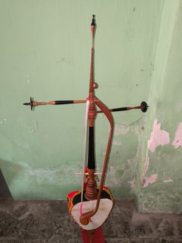 Rebab is a traditional Javanese musical instrument, played by stroking the strings like a violin. photo