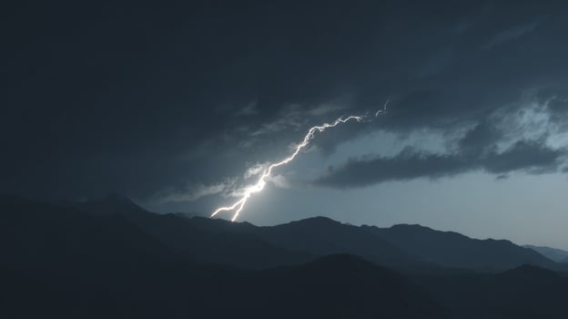 Dramatic Lightning Strike Illuminates Stormy Skies Over Rugged Mountain Landscape at Dusk photo