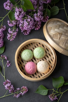 Steamed buns with lilacs photo