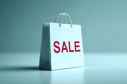 Elegant White Shopping Bag with Bold Red SALE Letters on Light Blue Background photo