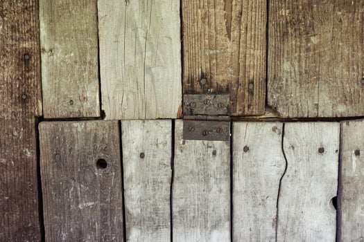 Rustic wood texture with weathered planks and visible grain details. photo
