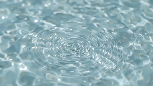 Close-up of water with colorful splash circles as background photo