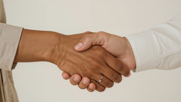 Close-up of a handshake symbolizing an agreement, conceptual background photo