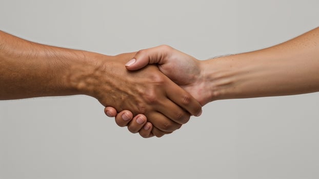 Close-up of a handshake symbolizing agreement and mutual understanding photo
