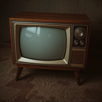 Retro-style television mockup featuring a blank screen and vintage display backdrop photo