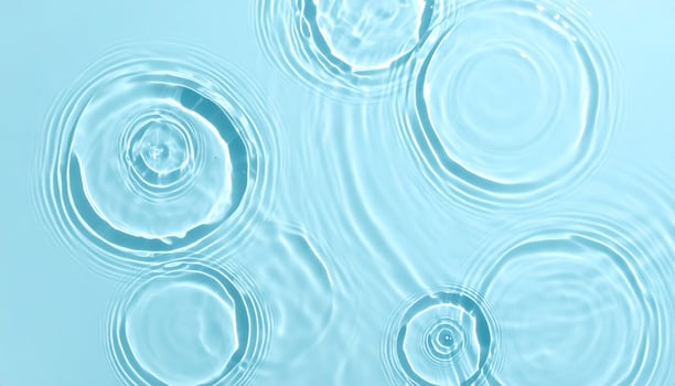 Background of calm, rippling light blue water photo