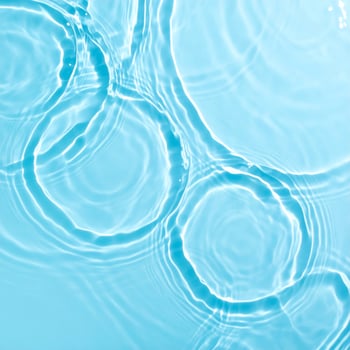 Background of gently rippling, light blue water. photo