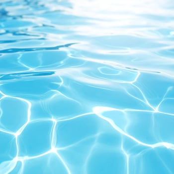 A background of turquoise water with gentle ripples and waves photo