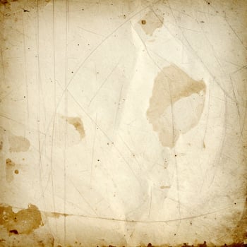 Vintage aged paper texture with a weathered, grunge-style background pattern. photo