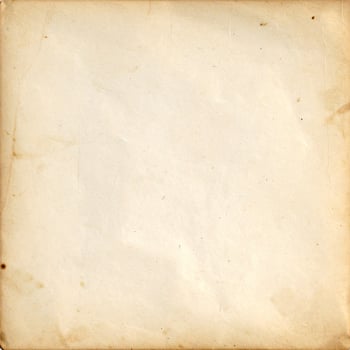 Vintage distressed paper with an aged, antique texture as a background photo
