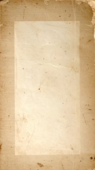 Vintage aged parchment texture with a weathered, distressed paper pattern background photo