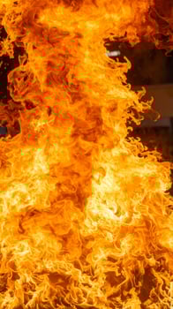 Intimate shot of blazing flames against a dark backdrop photo