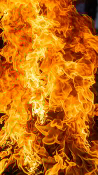 Intimate close-up of blazing flames in the background photo
