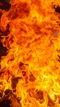 Close-up of vibrant flames in the background photo