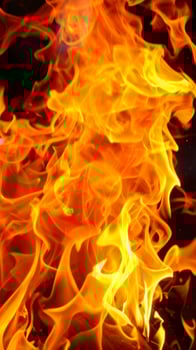 Close-up of flickering flames against a fiery background photo