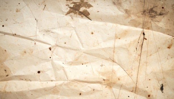Vintage distressed paper with an aged, textured appearance as a background. photo