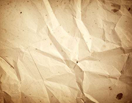 Vintage distressed paper texture with an aged, antique look background photo