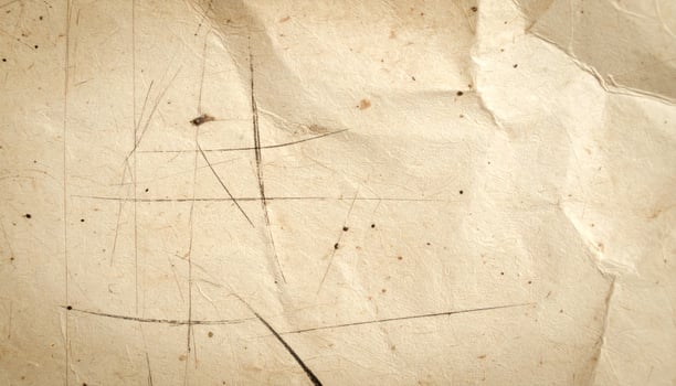Antique weathered paper with a rustic, worn grunge texture as a background photo