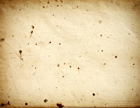 Vintage-style aged paper with a gritty, textured background resembling old parchment. photo