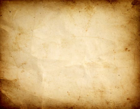 Vintage distressed paper texture with an aged, antique appearance and rugged pattern background photo