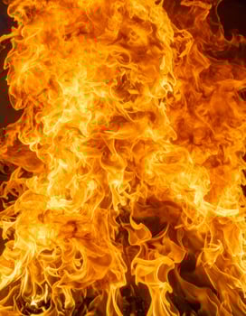 Close-up of fiery flames against the background photo