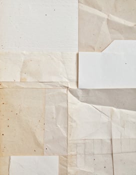 Close-up of a coarse, textured paper surface as a background photo