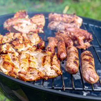 Close-up of succulent grilled meats, perfect for a summer barbecue feast photo