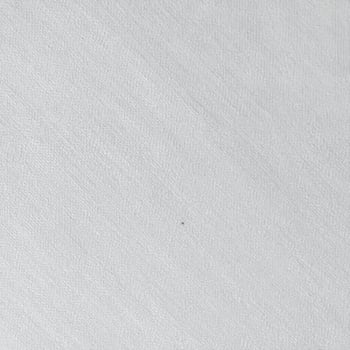Close-up of a simple cotton fabric texture background with a woven pattern photo