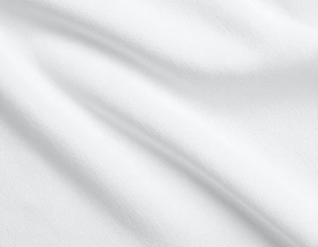 Close-up of plain cotton fabric with a simple woven pattern as the background photo