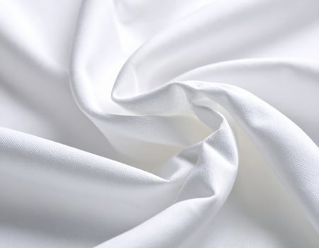 Close-up of a plain cotton fabric texture background with a simple woven pattern photo