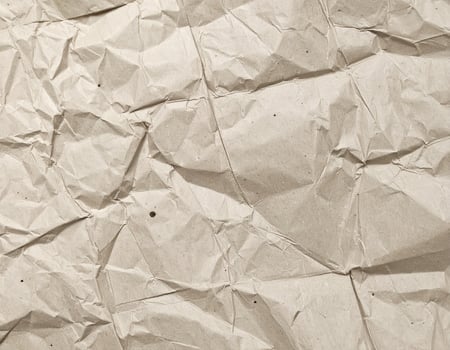 Close-up of a textured, coarse paper surface background photo