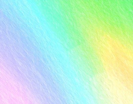 Close-up of a vibrant, rainbow-colored paper design in the background photo