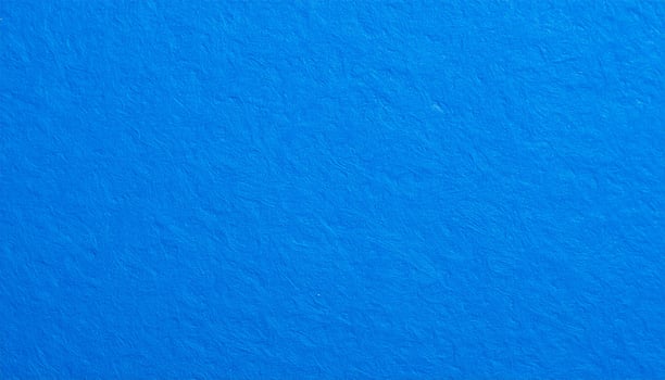 Close-up of vibrant electric blue paper with textured pattern as a background photo