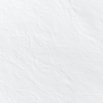 Close-up of a white, coarse paper surface with a textured pattern as a background photo