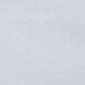 Close-up of a textured gray paper surface with a rugged, matte finish photo