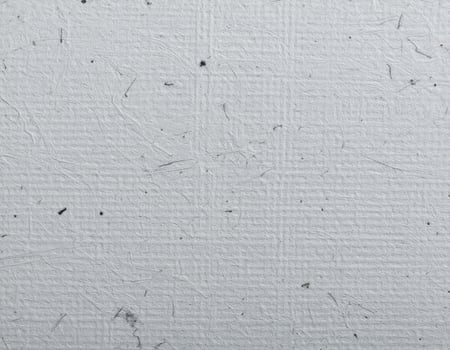 Close-up of a coarse, gray paper surface with textured pattern photo