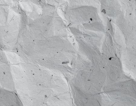 Close-up of a coarse, gray paper with a textured pattern background photo