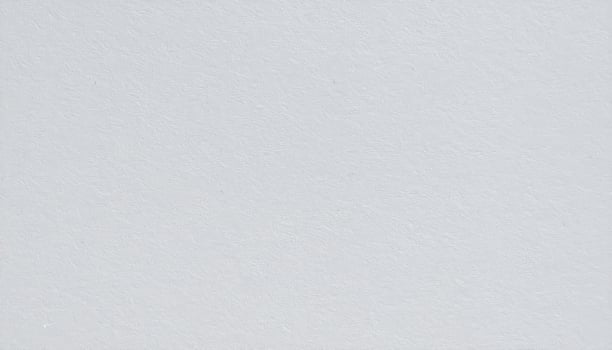 Close-up of a textured gray paper surface with a rough pattern. photo