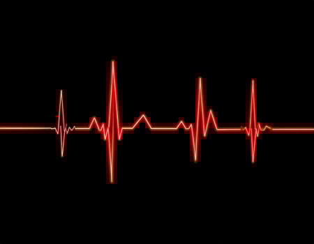Vivid vibrant heartbeat line against a dark backdrop photo