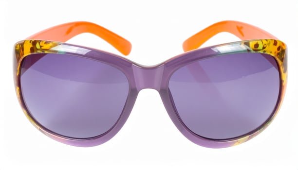 Brightly tinted sunglasses on a white backdrop, evoking a summer getaway vibe photo