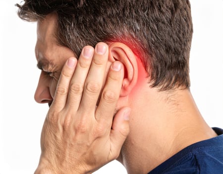 Illustration showing ear pain spreading to surrounding areas, depicted as a bright spot within the semi-transparent head against a white backdrop. photo
