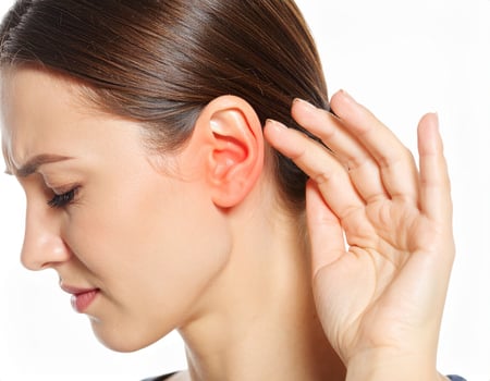 Radiating ear discomfort depicted as a glowing spot within the semi-transparent side of the head against a white backdrop photo