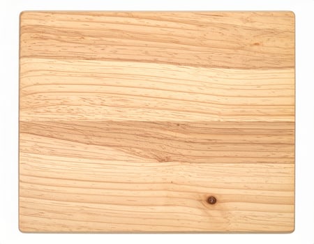 A top-down view of a wooden table surface against a white background. photo