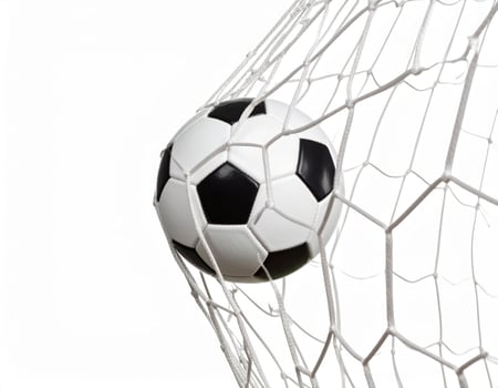 Football goal with a ball crossing the line against a plain white backdrop, capturing a scoring moment photo