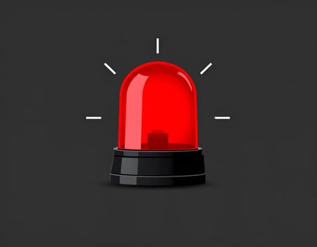 Alarm siren in red flashing over a gray backdrop, warning symbol photo