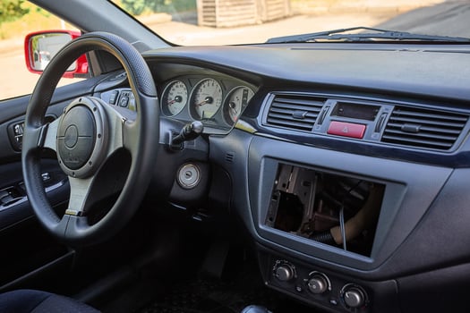 Contemporary urban vehicle dashboard with steering wheel and sensor display photo
