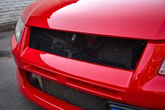 Close-up of contemporary red car headlights photo