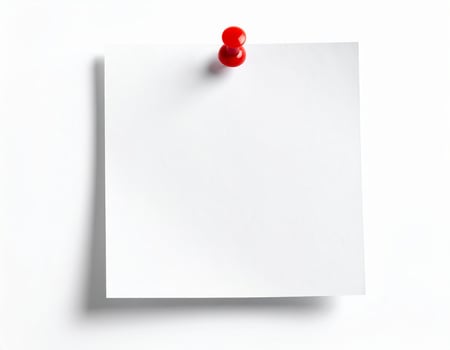 A piece of white note paper secured with a pin on a plain white surface photo
