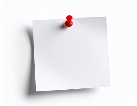 A plain white note paper pinned against a white backdrop photo